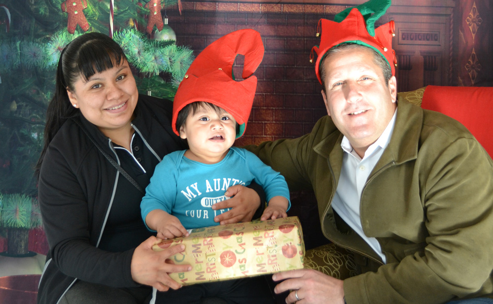 Joseph Tahl, Tahl Propp Equities made a special delivery of presents for the children in our Parenting & Child Development program.