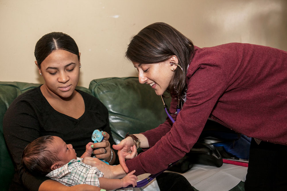 Brigida gives Camryn a checkup.